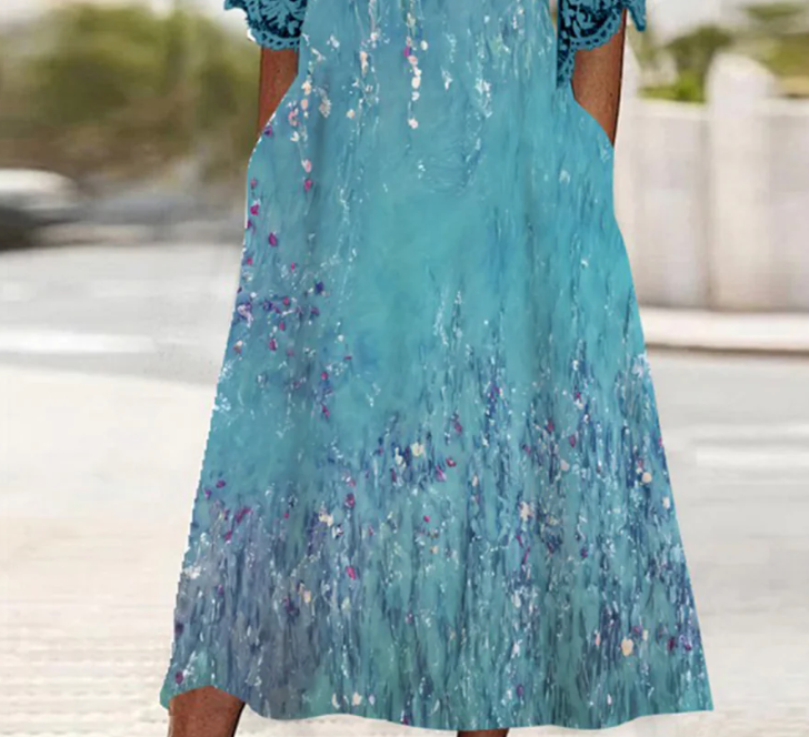 Superbe robe midi bleue à manches mi-longues et poche latérale