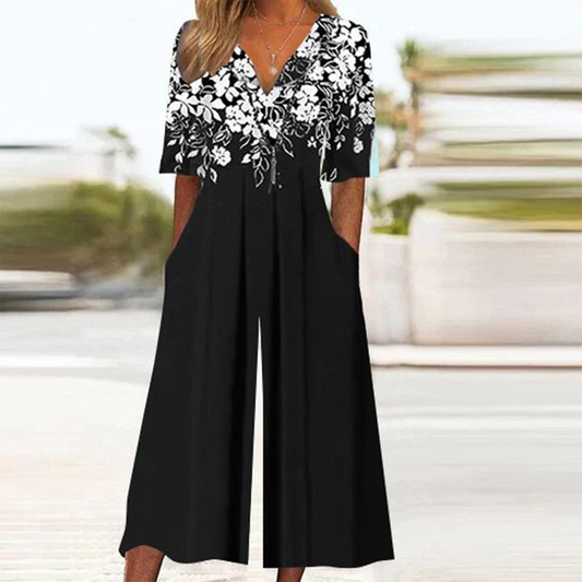 Combinaison noire à manches mi-longues et imprimé floral
