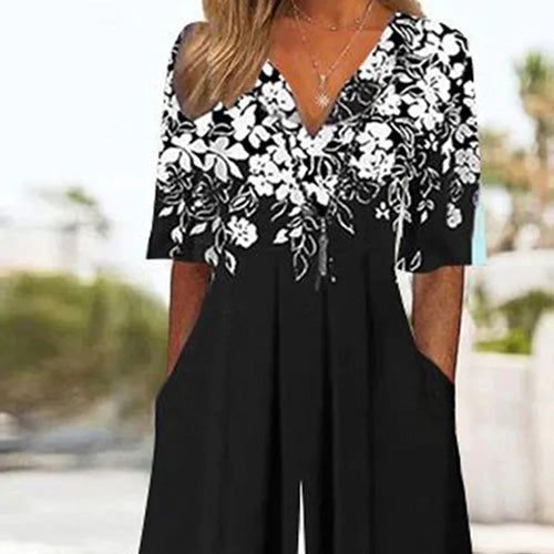 Combinaison noire à manches mi-longues et imprimé floral