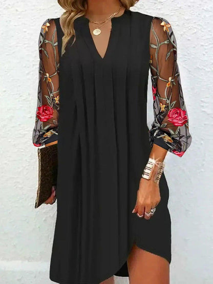 Julia Mini-robe élégante à manches transparentes et col en V